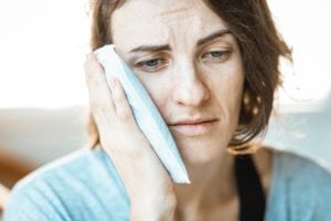 Women In Pain From Wisdom Teeth With Ice Pack