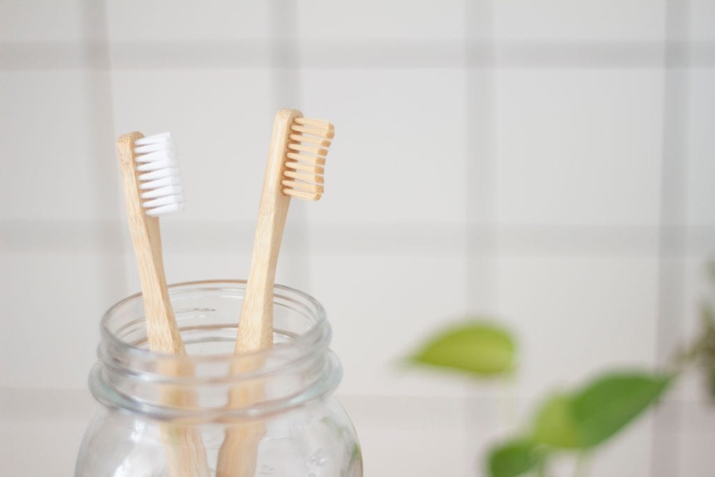 Two Toothbrushes In A Jar